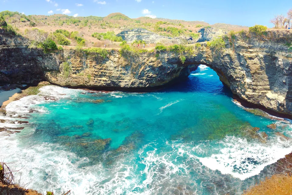 Broken Beach on Nusa Penida: a natural rock arch around a turquoise cove