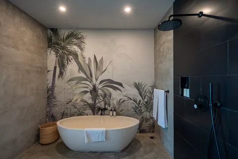 Concrete Serenity's bathroom with a freestanding bath and separate shower